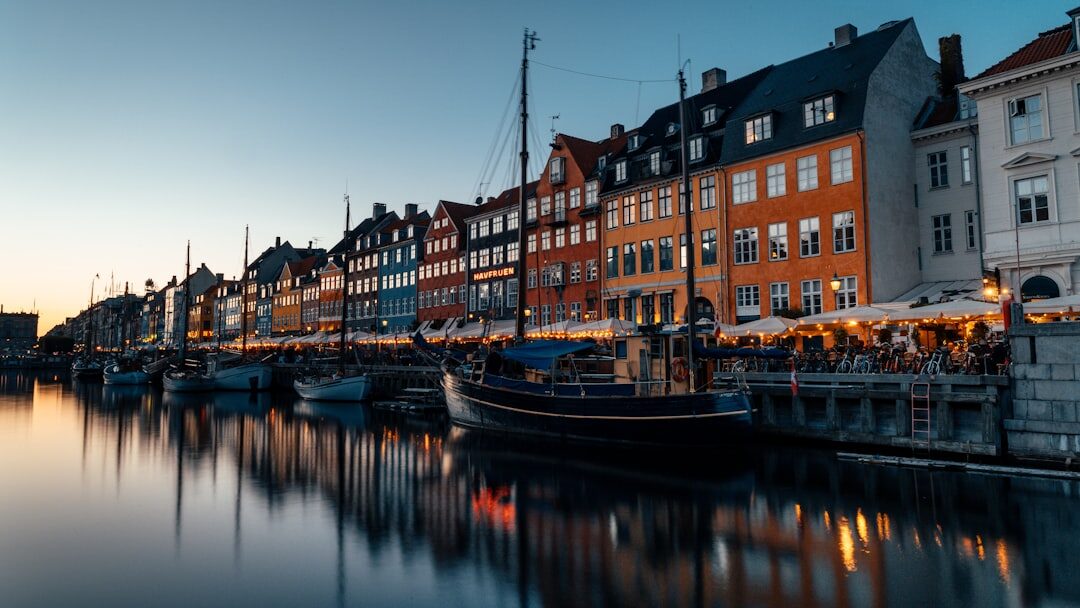 Danish fishing harbor at dusk with silhouette of fisherman