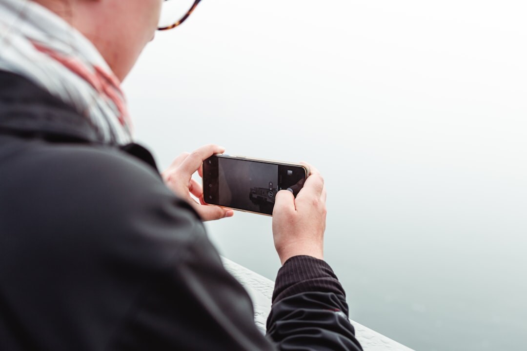 Portrait of a Danish photographer holding a camera