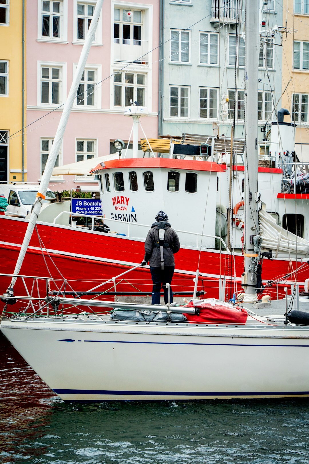 Danish fisherman mending nets at the harbor